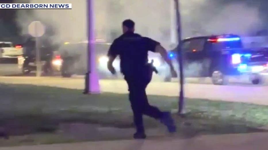 Dearborn police run to respond after a firework was shot at other officers. Courtesy TCD Dearborn.