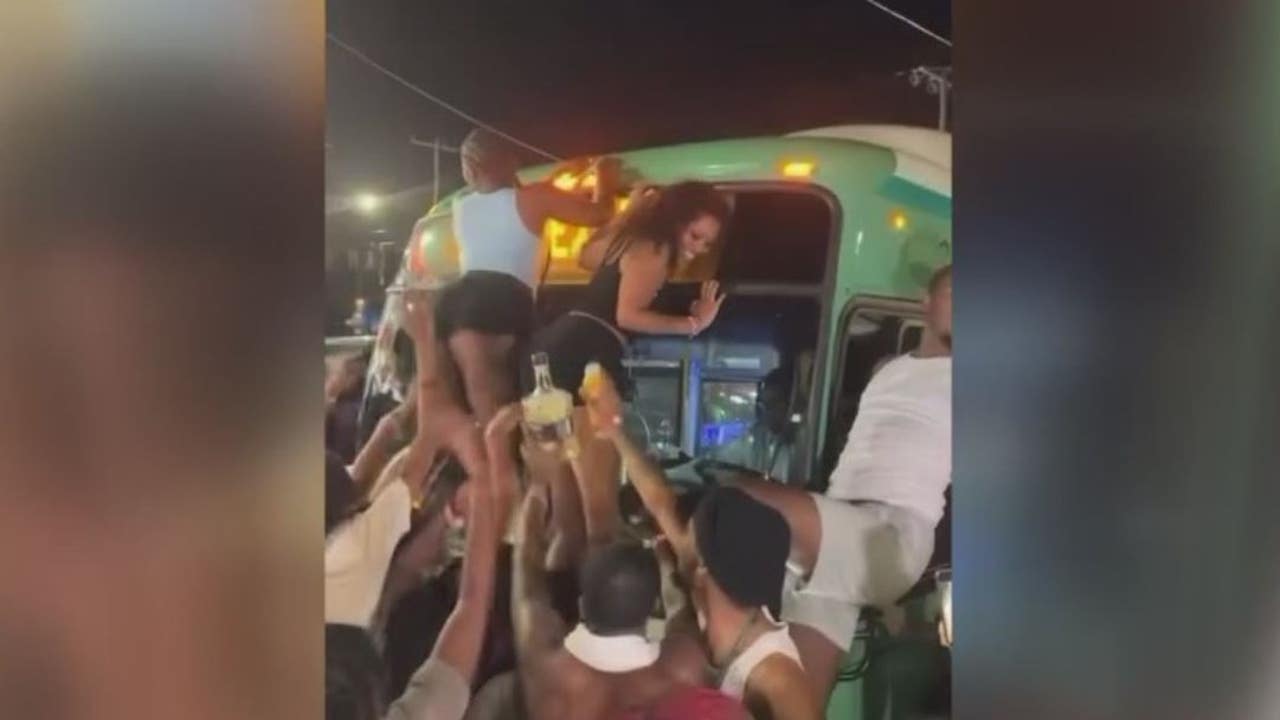 Women climb Detroit bus to twerk during street takeover by more than 100 party-goers