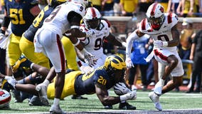 No. 17 Michigan beats Arkansas State 28-18 on the ground, overcoming Davis Warren’s 3 interceptions