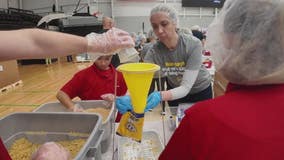 Volunteers make 9/11 a day of service packing food with Forgotten Harvest