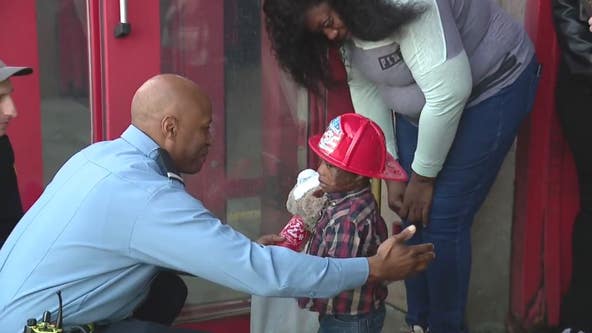 Detroit firefighters reunite with little boy they rescued from burning home