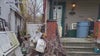 Detroit police help clean up home surrounded by junk, changing the image of a whole block