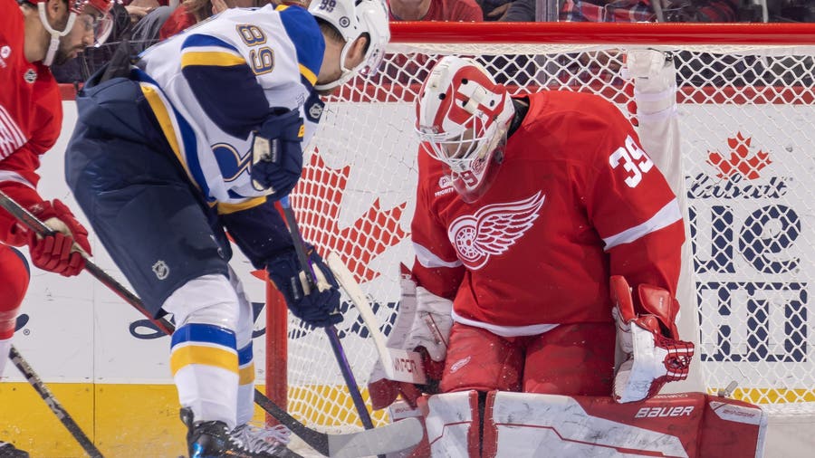 Holloway gets 1st career hat trick as the Blues blank the Red Wings 4-0