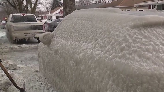 Water main break leaves two Dearborn Heights cars frozen in a thick layer of ice
