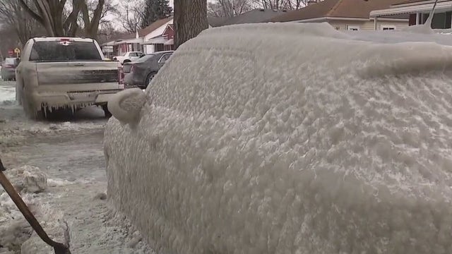 Water main break leaves two Dearborn Heights cars frozen in a thick layer of ice