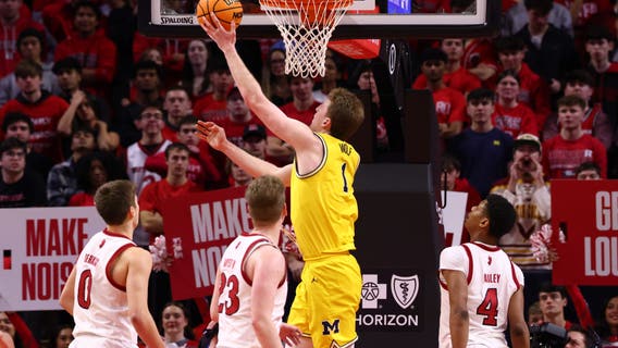 Wolf records double-double to lead Michigan to 66-63 win over Rutgers