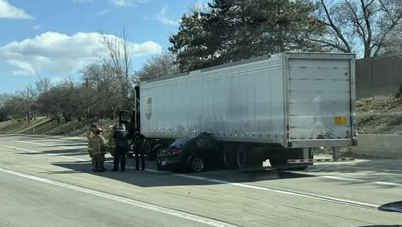 I-696 crash: Car gets stuck under semi truck, slowing traffic