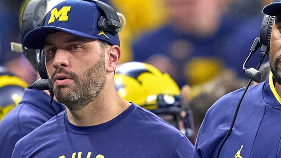 Hacking investigation: Ex-Michigan, Ravens coach had thousands of intimate images