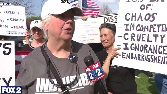 Protesters amass against Trump outside Macomb Community College for visit