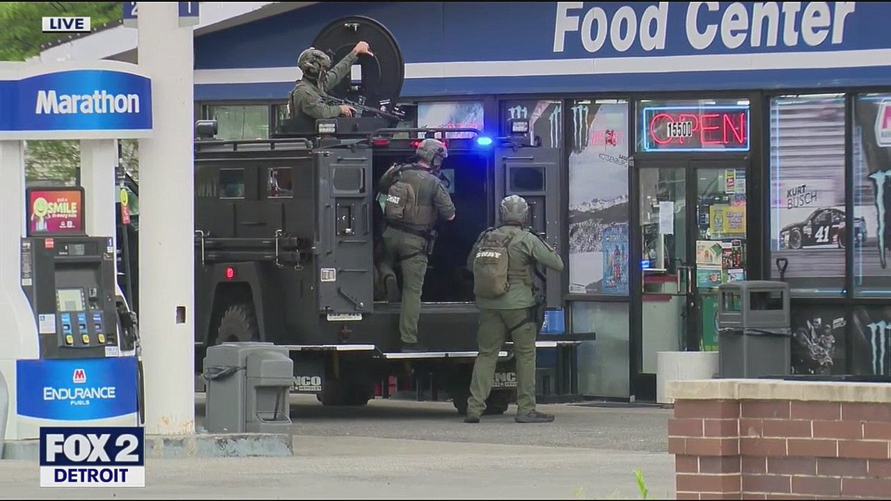 Armed man barricaded inside Allen Park gas station involved in police standoff