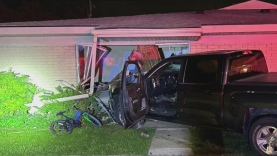 Truck slams into Pontiac apartment with children inside, driver arrested