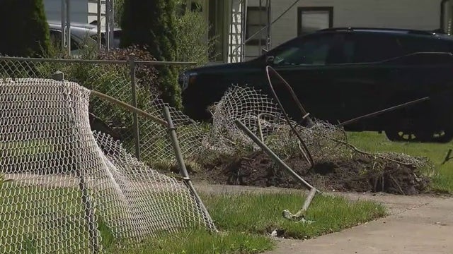 Driver fleeing Warren police crashes into parked vehicles, house
