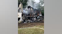 Woman dies in mobile home fire, three teenagers escape