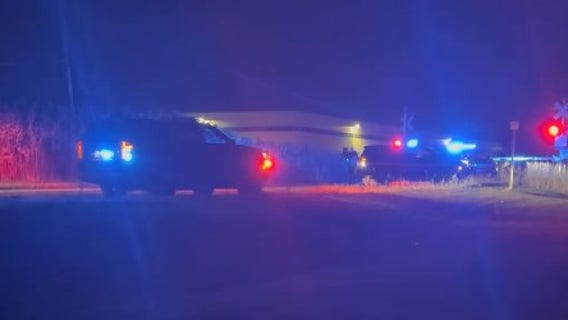 Truck overturns after striking control box near train tracks in Brownstown Township