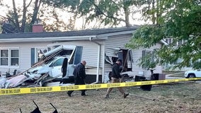 Car crashes into Center Line home, throwing sleeping child out of house