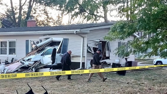 Car crashes into Center Line home, throwing sleeping child out of house