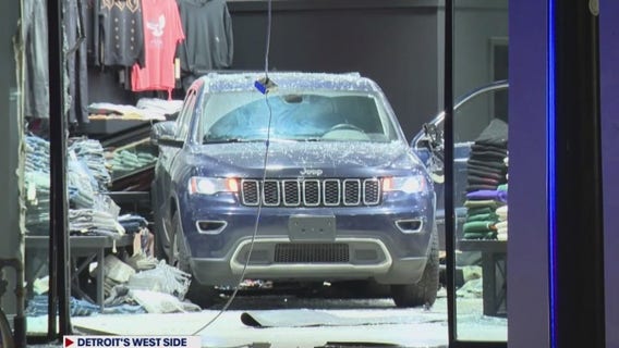 Smash and grab: Thieves crash SUV into Detroit clothing store for robbery