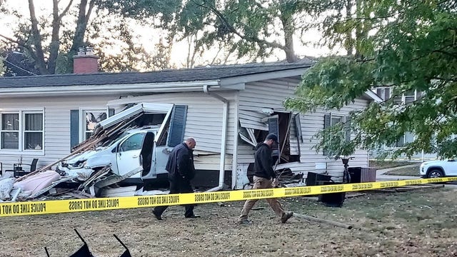 Car crashes into Center Line home, throwing sleeping child out of house