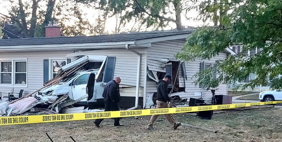Car crashes into Center Line home, throwing sleeping child out of house