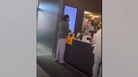 Woman on camera hurls hot coffee on McDonald's manager