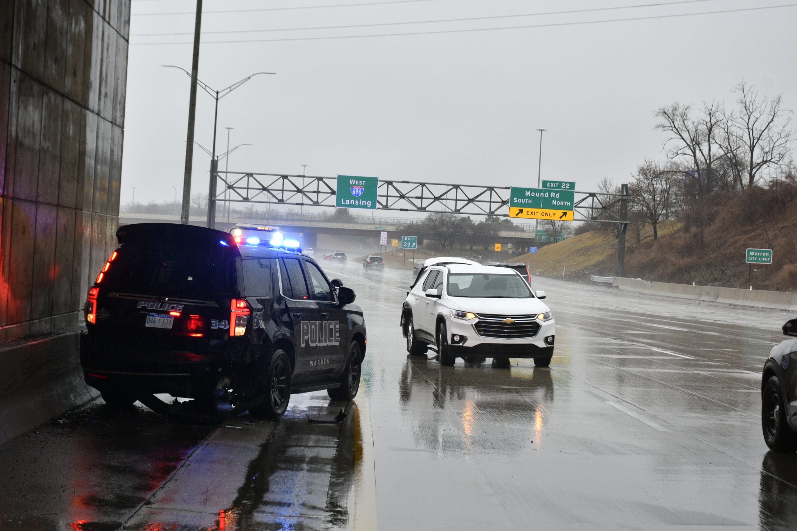 Stopped Warren police cruiser crashed into by SUV on 696