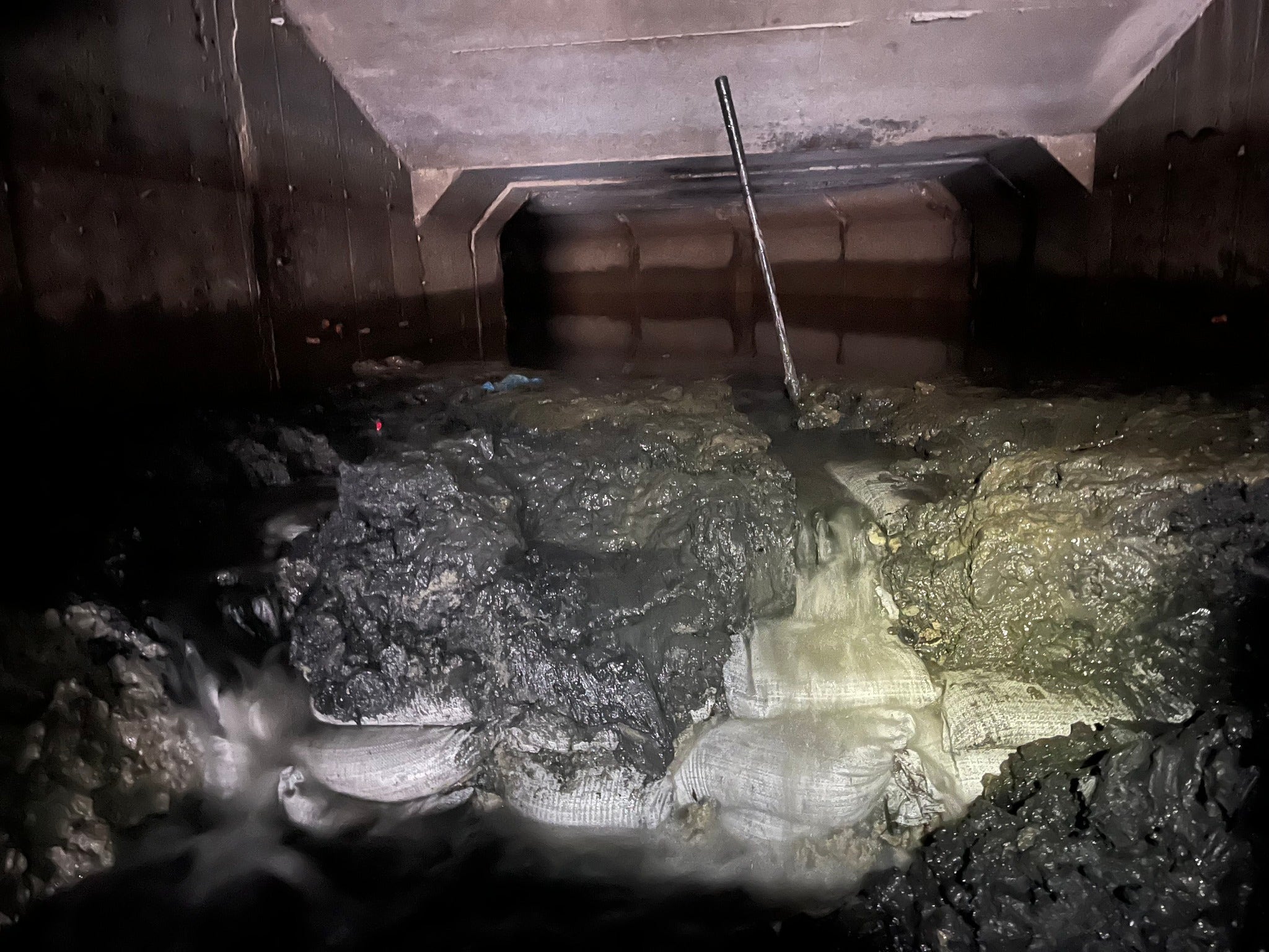 Macomb flooding mystery solved after crews discover sandbags beneath culvert