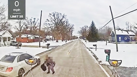 Video: Romulus student nearly hit by car during school bus stop