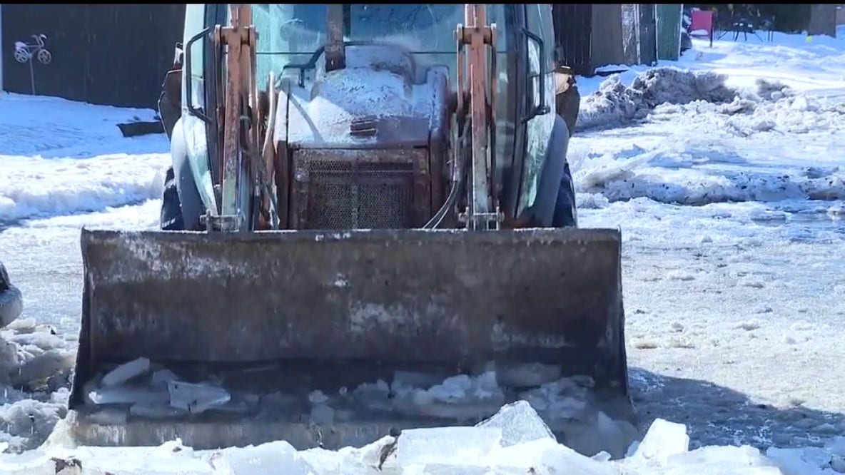 Melvindale neighborhood flooded and frozen over after pipe bursts from Arctic temperatures