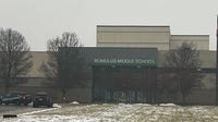 Man arrested after bringing gun to Romulus Middle School
