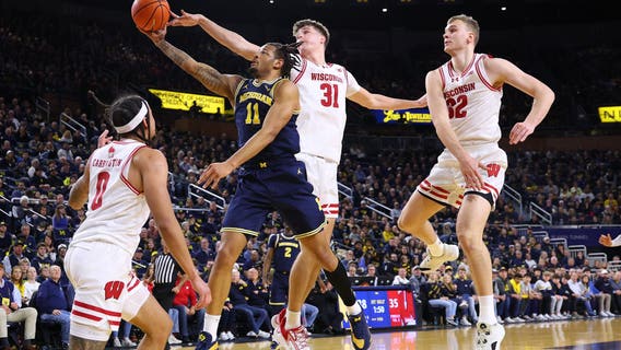 Wisconsin beats No. 2 Michigan 91-88 to give Wolverines their 1st loss of the season