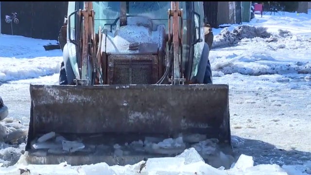 Melvindale neighborhood flooded and frozen over after pipe bursts from Arctic temperatures
