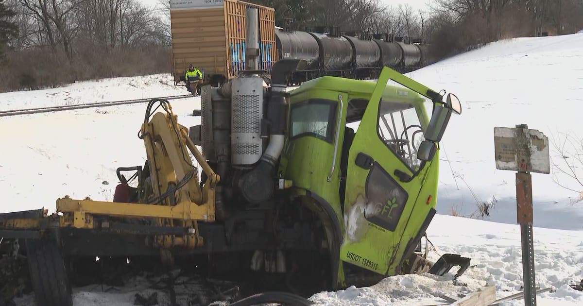 Dump truck hits train in west Michigan