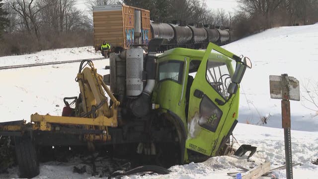 Dump truck hits train in west Michigan