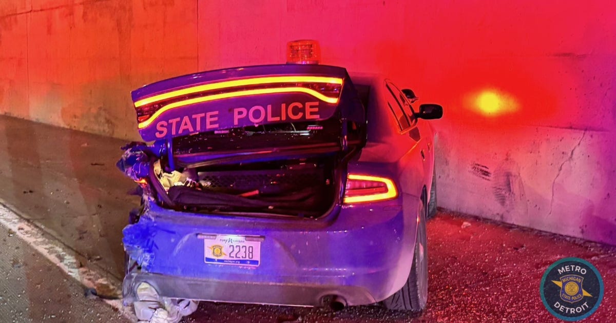 Driver runs away after hitting Michigan State Police car, crashing into Lodge Freeway wall