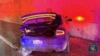 Driver runs away after hitting Michigan State Police car, crashing into Lodge Freeway wall