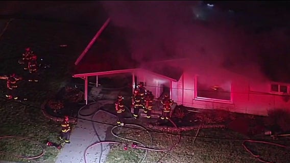 Livonia firefighter not seriously injured after falling through floor while battling house fire