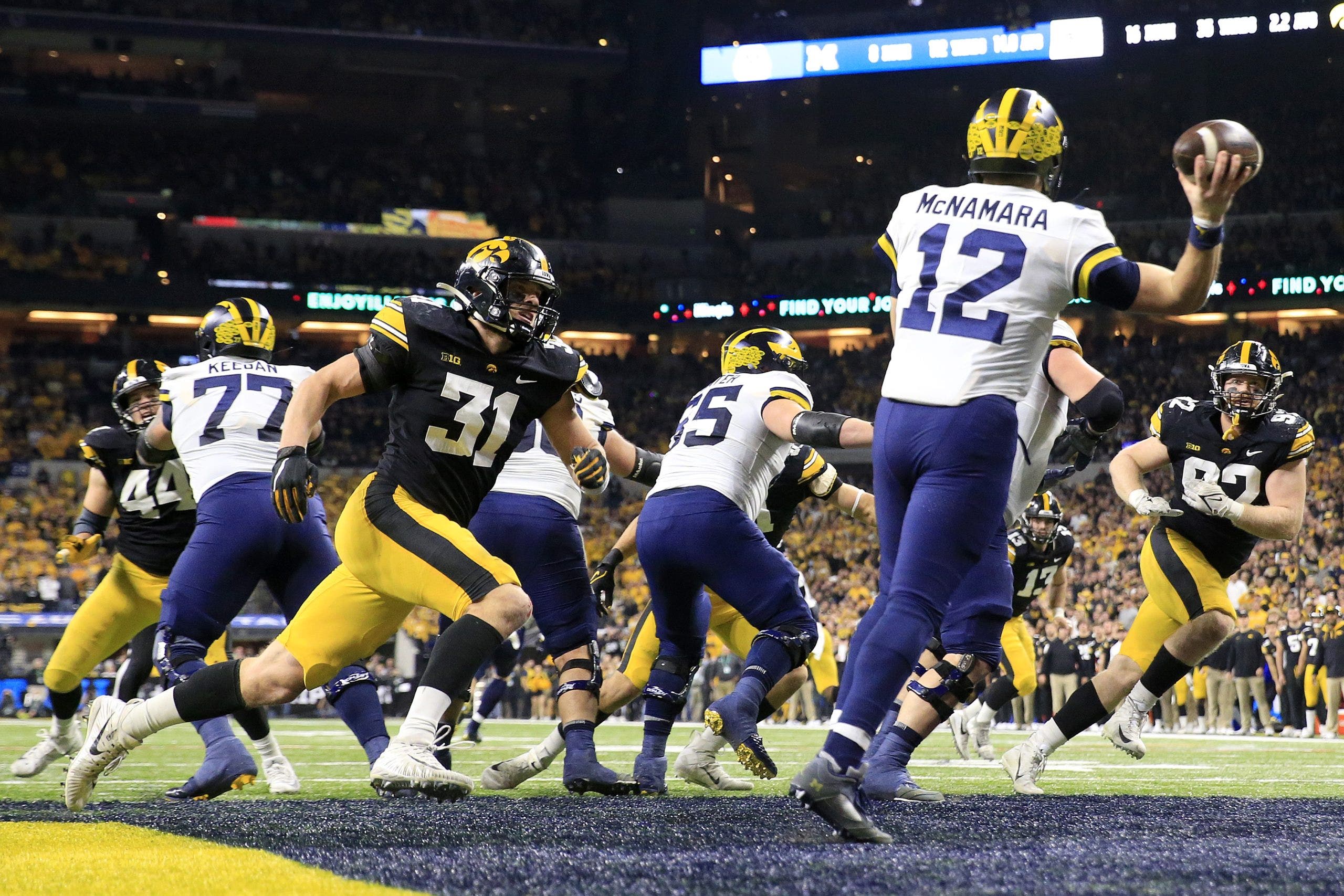 Iowa forfeiting 4 games, including win over Michigan State, for tampering with former Michigan quarterback