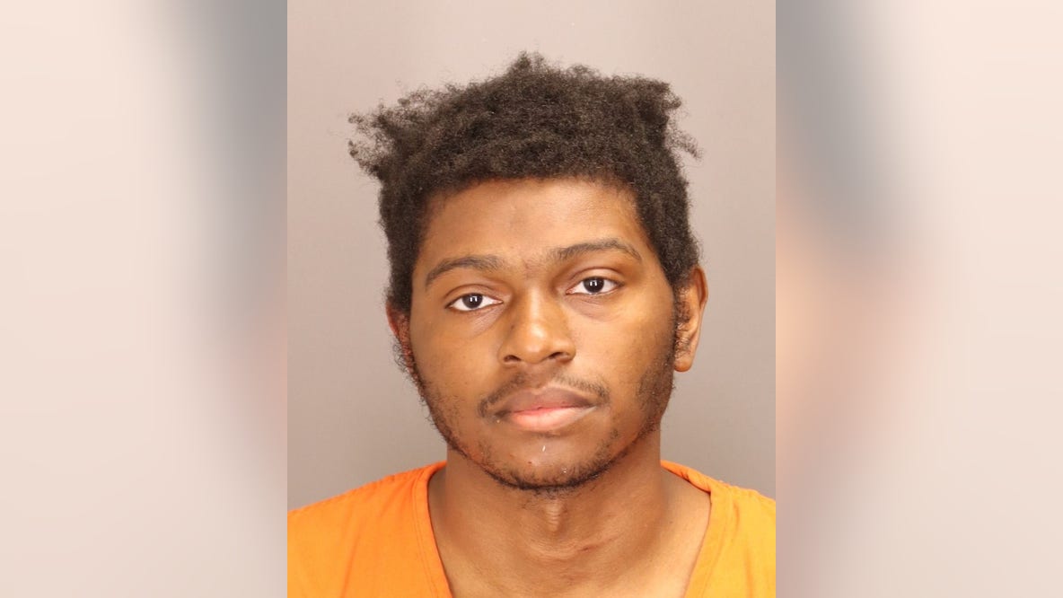 Man charged after woman shot, carjacked outside Oakland County business