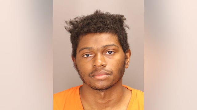 Man charged after woman shot, carjacked outside Oakland County business