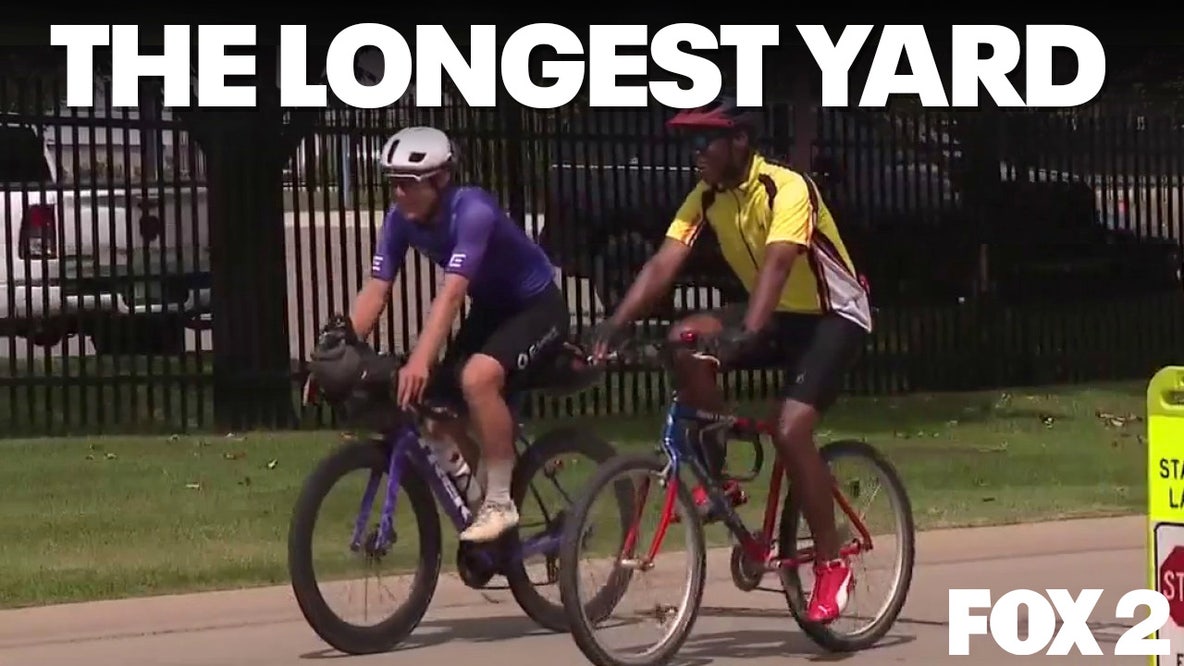 Cyclist's 11,000 mile journey passes through Lions training camp with Super Bowl ball