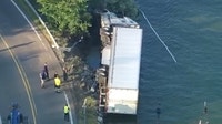Semi-truck crash into Pine Lake in West Bloomfield cause revealed by police