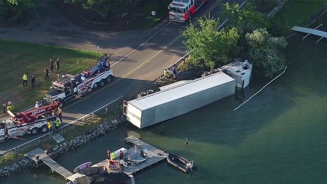 Semi-truck tips into Pine Lake in West Bloomfield, first responders on scene