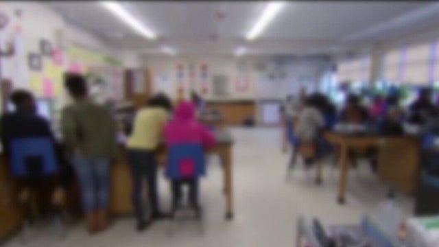 Detroit public schools pay money to fight absenteeism