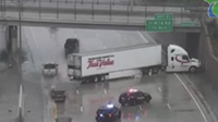 Jackknifed semi-truck crash on WB I-696 closes freeway