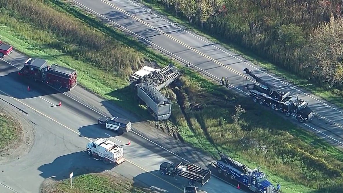 Semi-truck gravel hauler rollover crash scene on NB US-23 causing massive delays