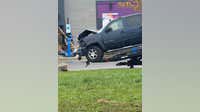 Truck runs through apartment sign, into Brownstown Taco Bell building