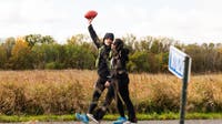 Lions fan runs from Green Bay to Detroit with game ball in honor of wife's cancer journey