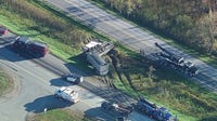 Semi-truck gravel hauler rollover crash scene on NB US-23 causing massive delays