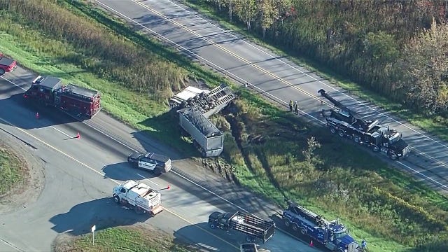 Semi-truck gravel hauler rollover crash scene on NB US-23 causing massive delays