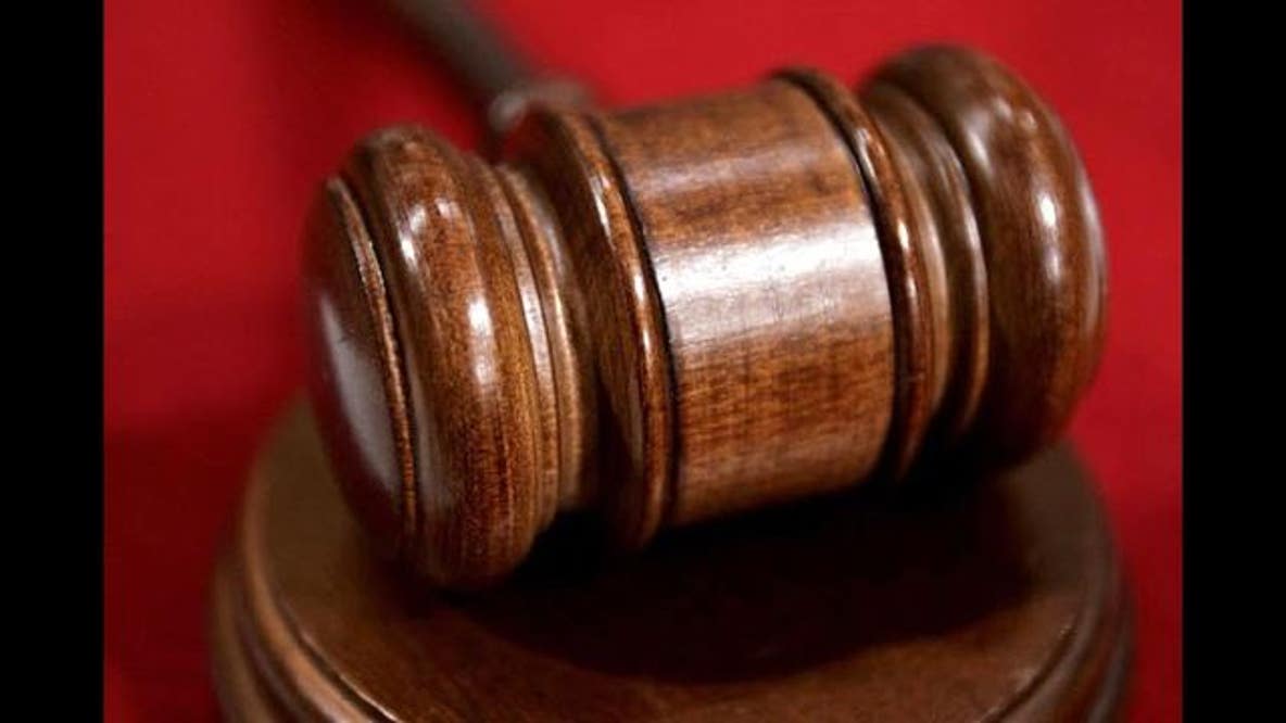 Postal worker charged with collecting benefits for deceased ex-spouse: officials